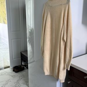 Cream size M sweater never worn. Wear alone or with leggings.